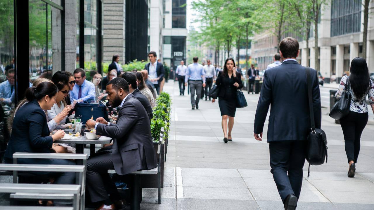 Office workers on a busy business district street at lunchtime